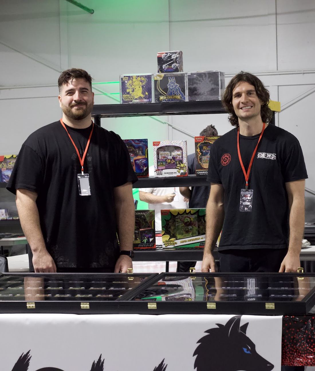 Two vendors behind their booth at the ATL Card Expo